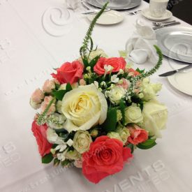 Table setting- roses and silver chargers.