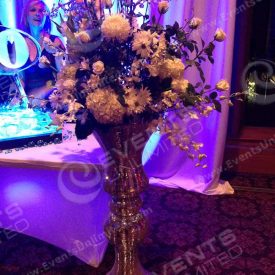 Giant sparkle vases with dramatic floral arrangement.